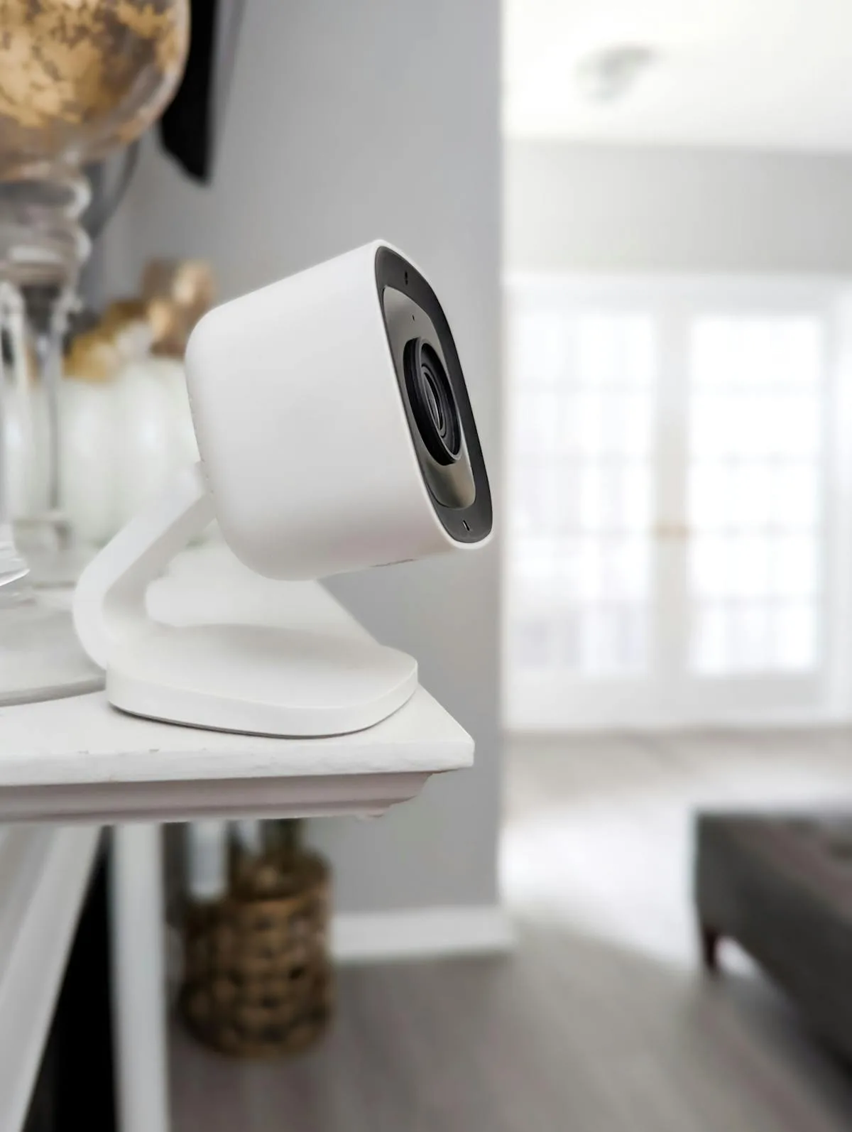 Close-up of an outdoor CCTV camera installed on a wall for security purposes.