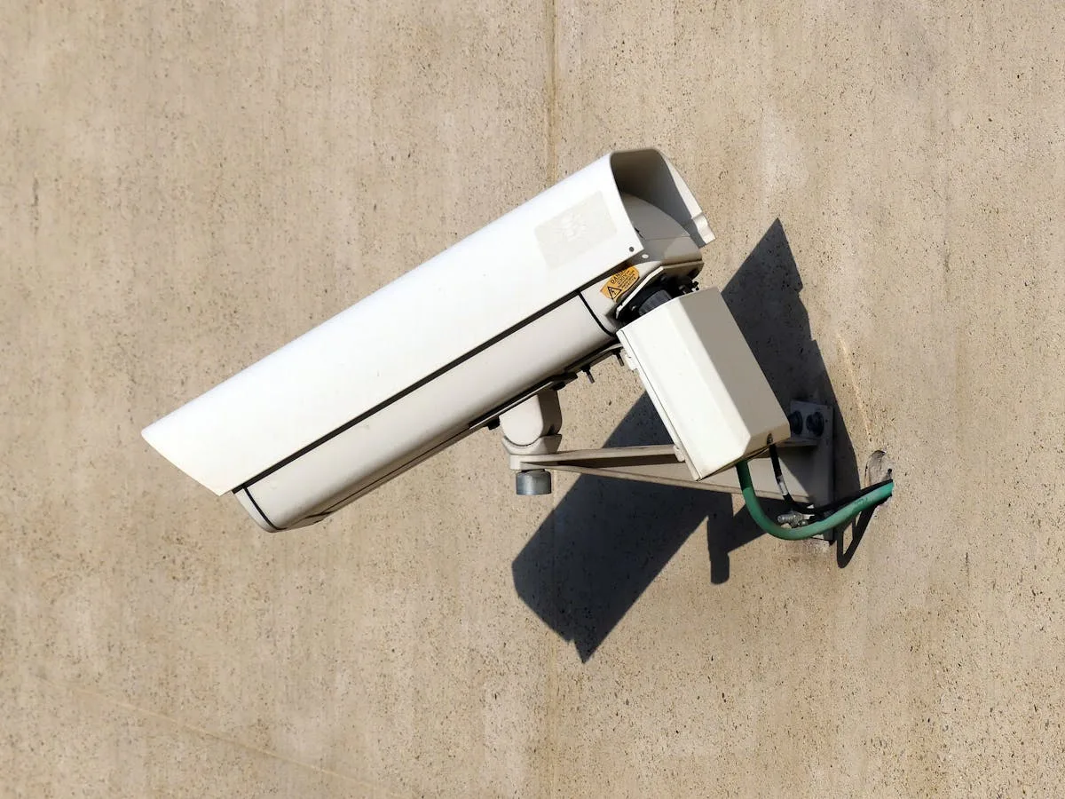 Close-up of an indoor ceiling-mounted security camera for surveillance applications.