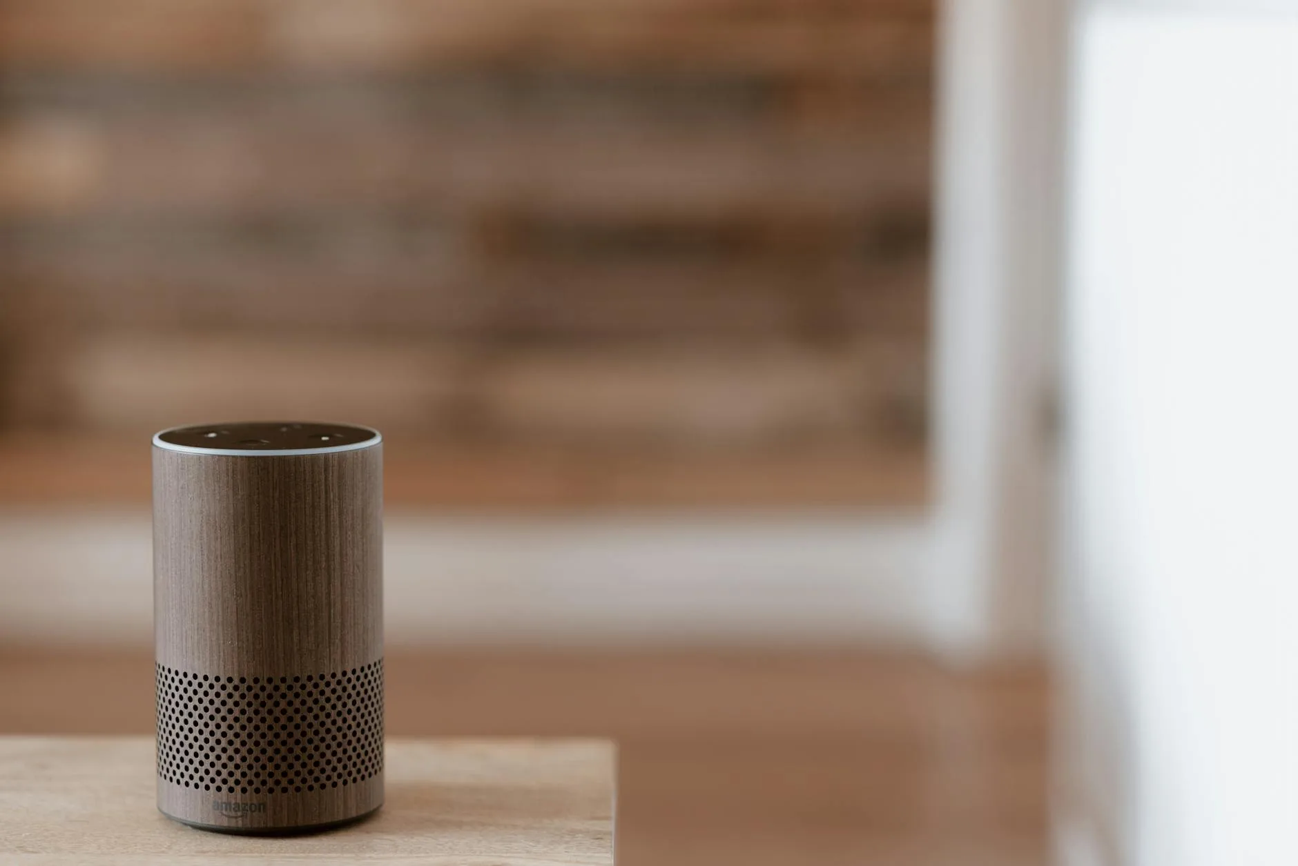 Multiple smart speakers arranged in different rooms of a home