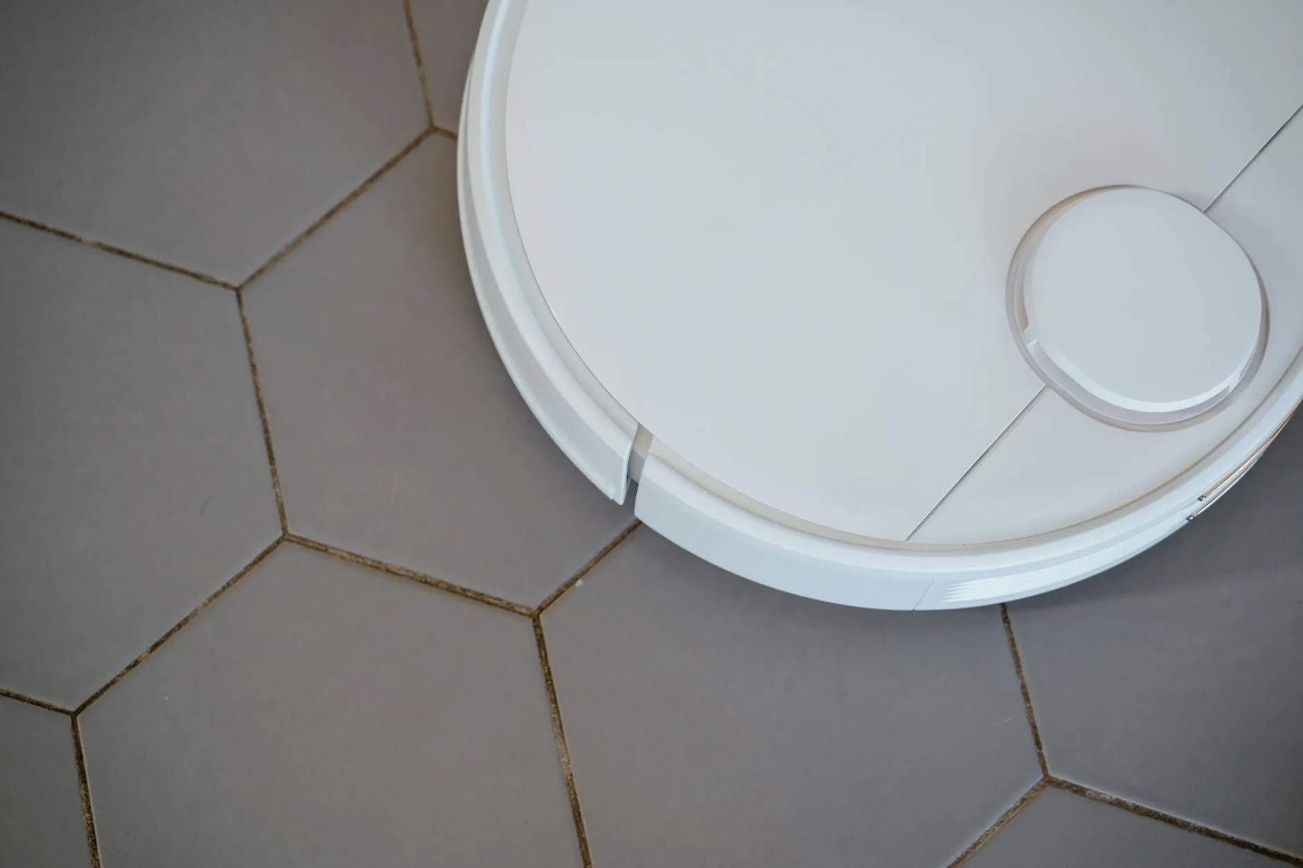 Robot vacuum docked at self-emptying base station