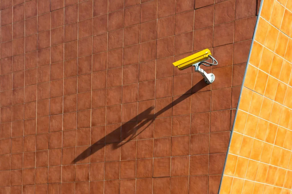 Outdoor security camera mounted on a house wall