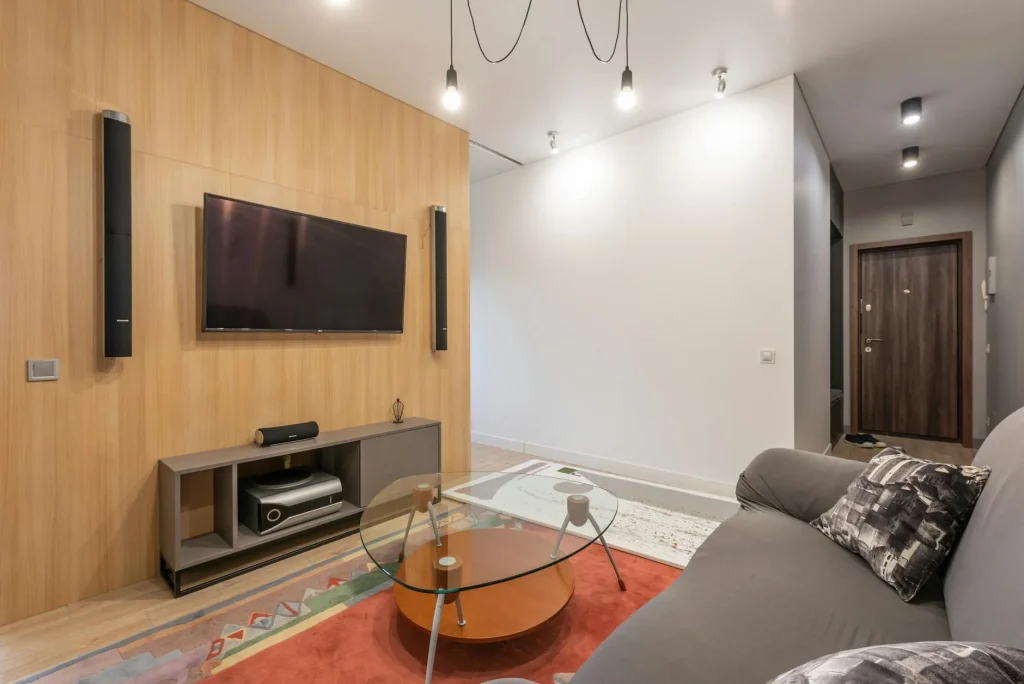 Smart home security system with sensors and alarm panel in a modern living room