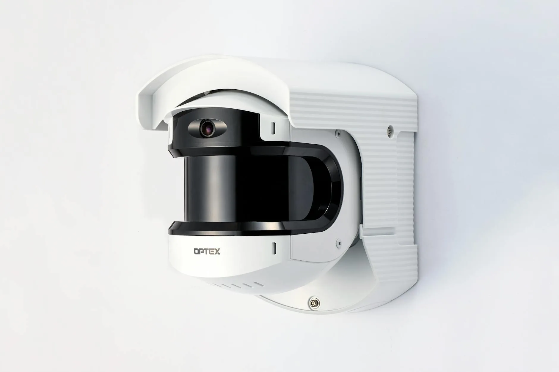 Security camera mounted on outside wall of house