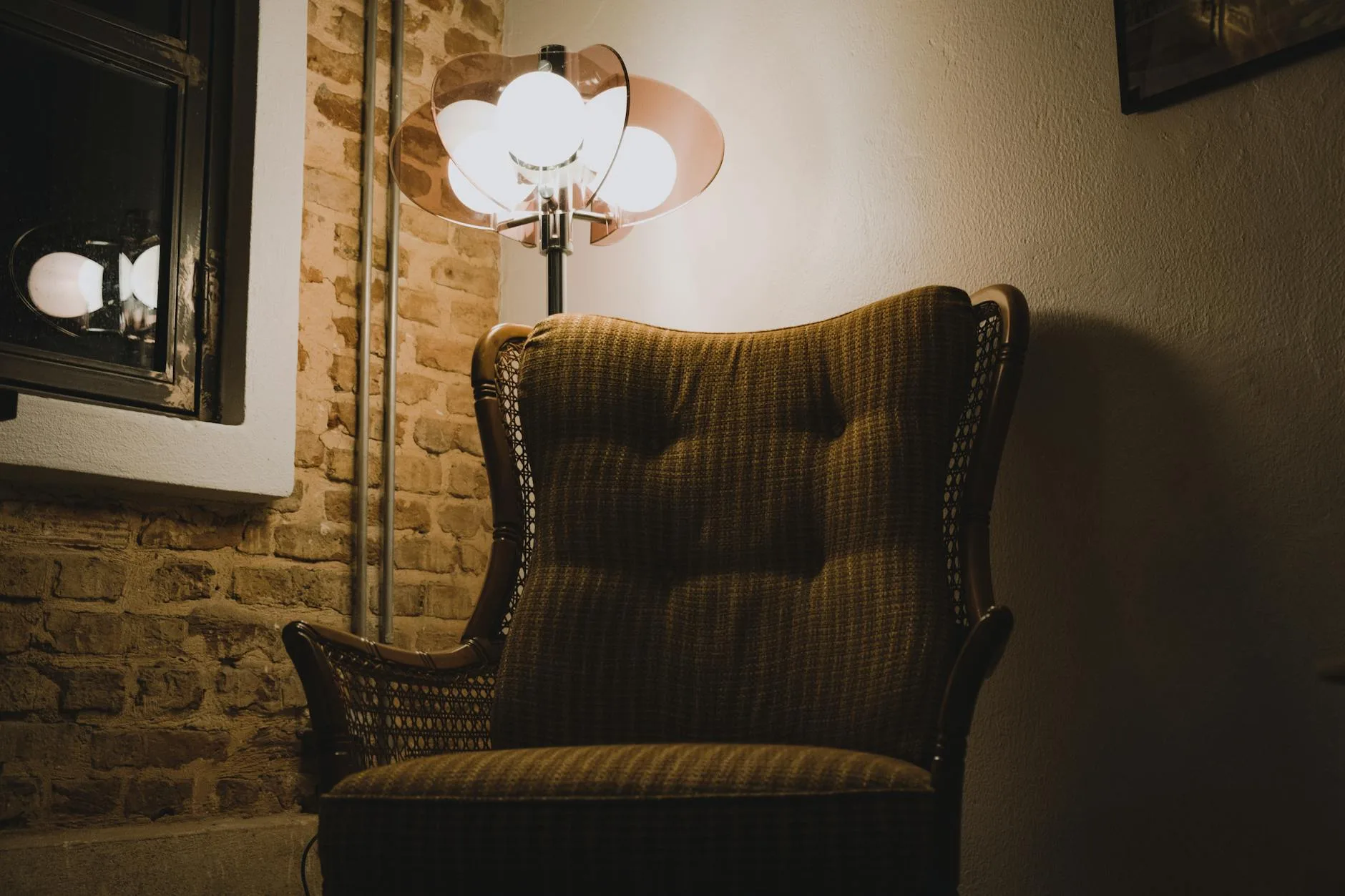 Warm dim lamp light in a living room for an evening voice assistant routine